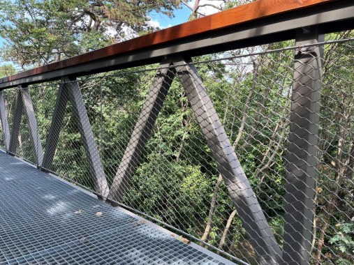 Wire mesh railings on a treetop walkway in Balatónboglar