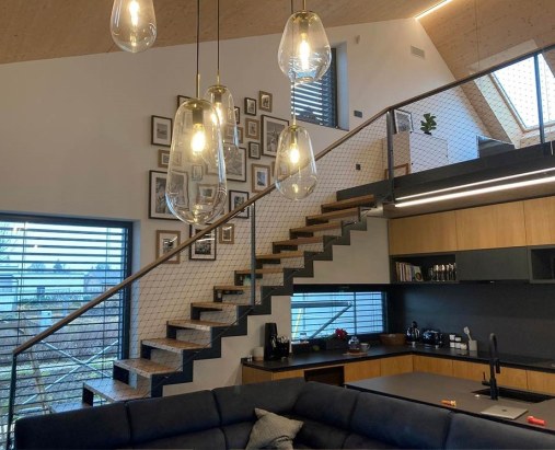 Wire mesh staircase railing in residential house