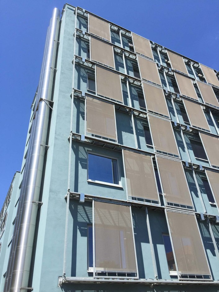 Tensioned metal facade using wire fabrics.