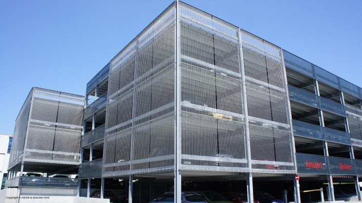 Metal facade of a parking garage, wire mesh used